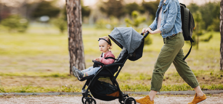 Child traveling in pram with mother