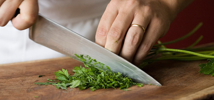 chef chopping parsley